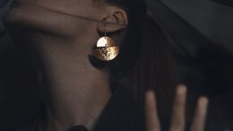 person wearing gold and silver ring