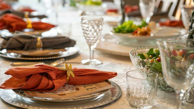a table set with place settings and napkins