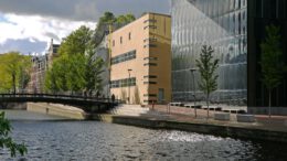 a building next to a body of water