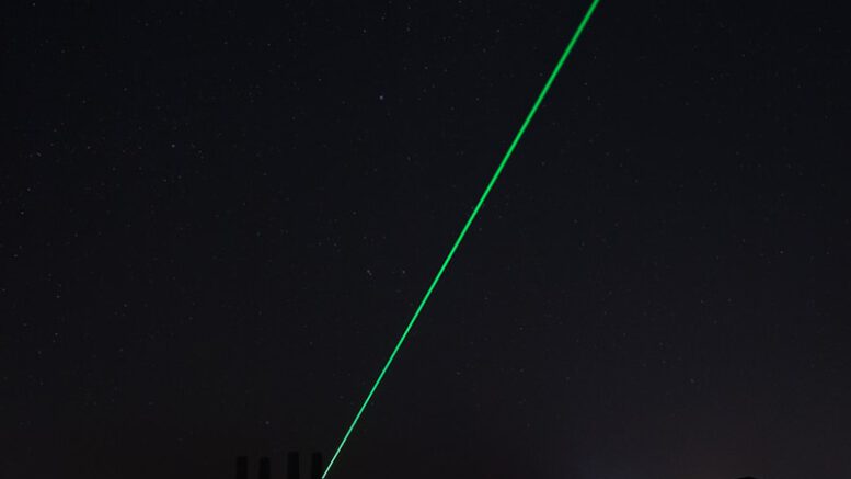 city buildings near body of water during nighttime