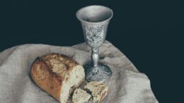 sliced of bread beside goblet